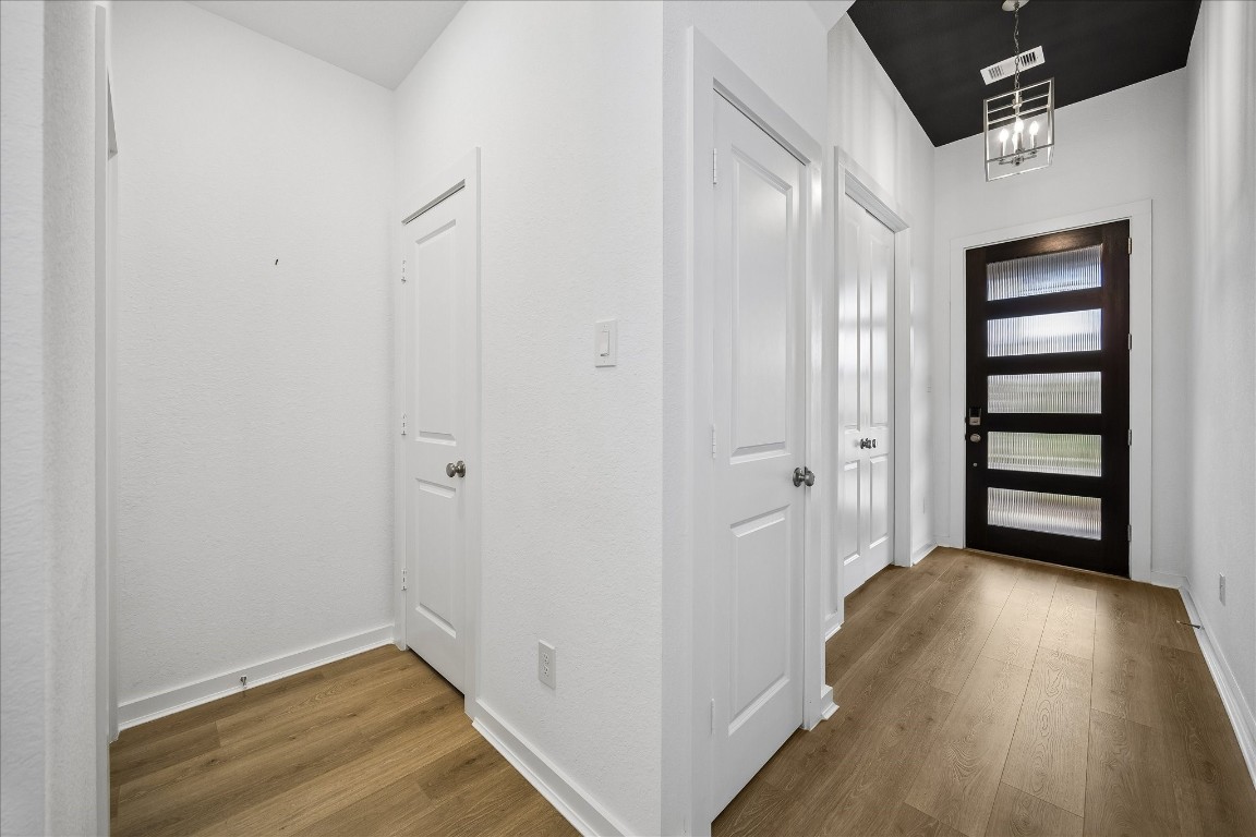 15823 Bird Of Conroe, TX 77302 - Photo 12 of 27 a view of a hallway with wooden floor and closet