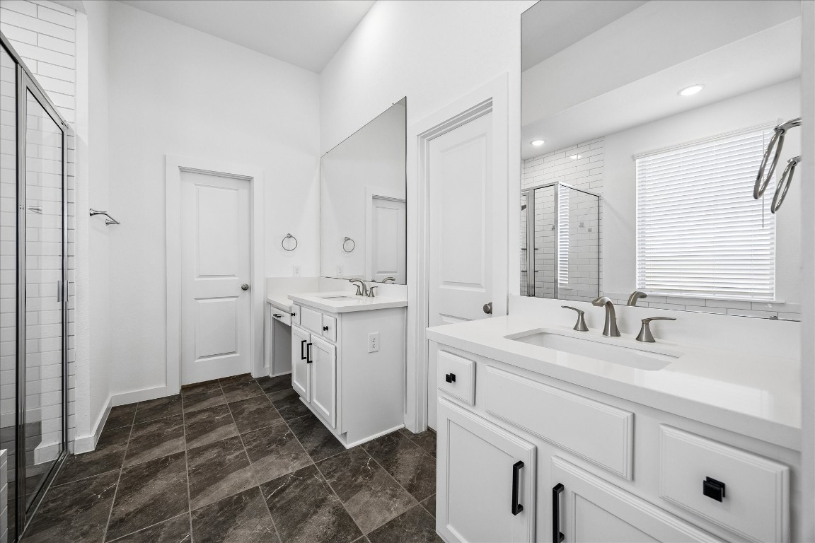 15823 Bird Of Conroe, TX 77302 - Photo 16 of 27 a spacious bathroom with a double vanity sink mirror and