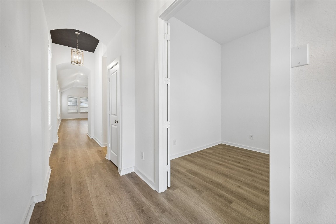 15823 Bird Of Conroe, TX 77302 - Photo 2 of 27 a view of a hallway with wooden floor