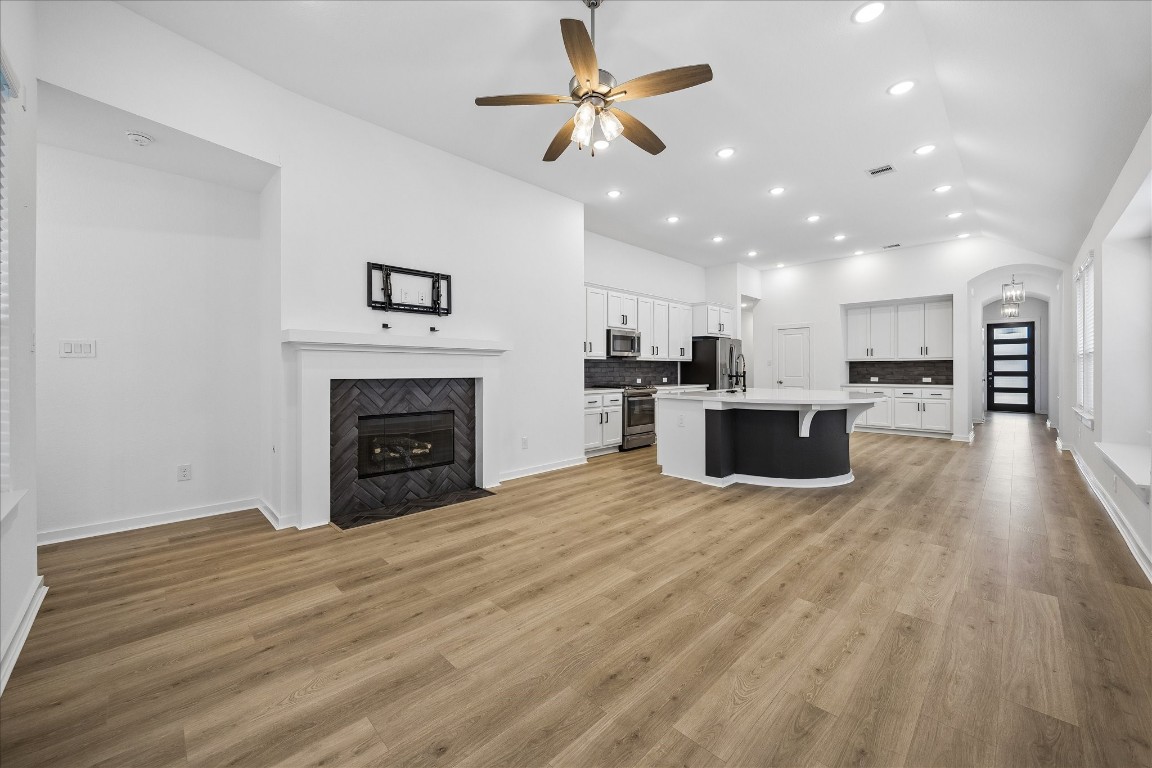 15823 Bird Of Conroe, TX 77302 - Photo 4 of 27 a view of kitchen and a fireplace with wooden floor