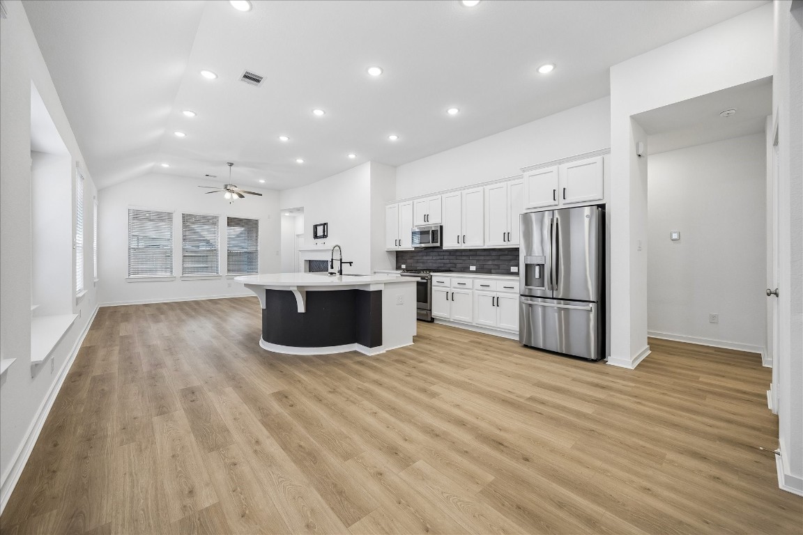 15823 Bird Of Conroe, TX 77302 - Photo 5 of 27 a kitchen with stainless steel appliances a refrigerator and a microwave