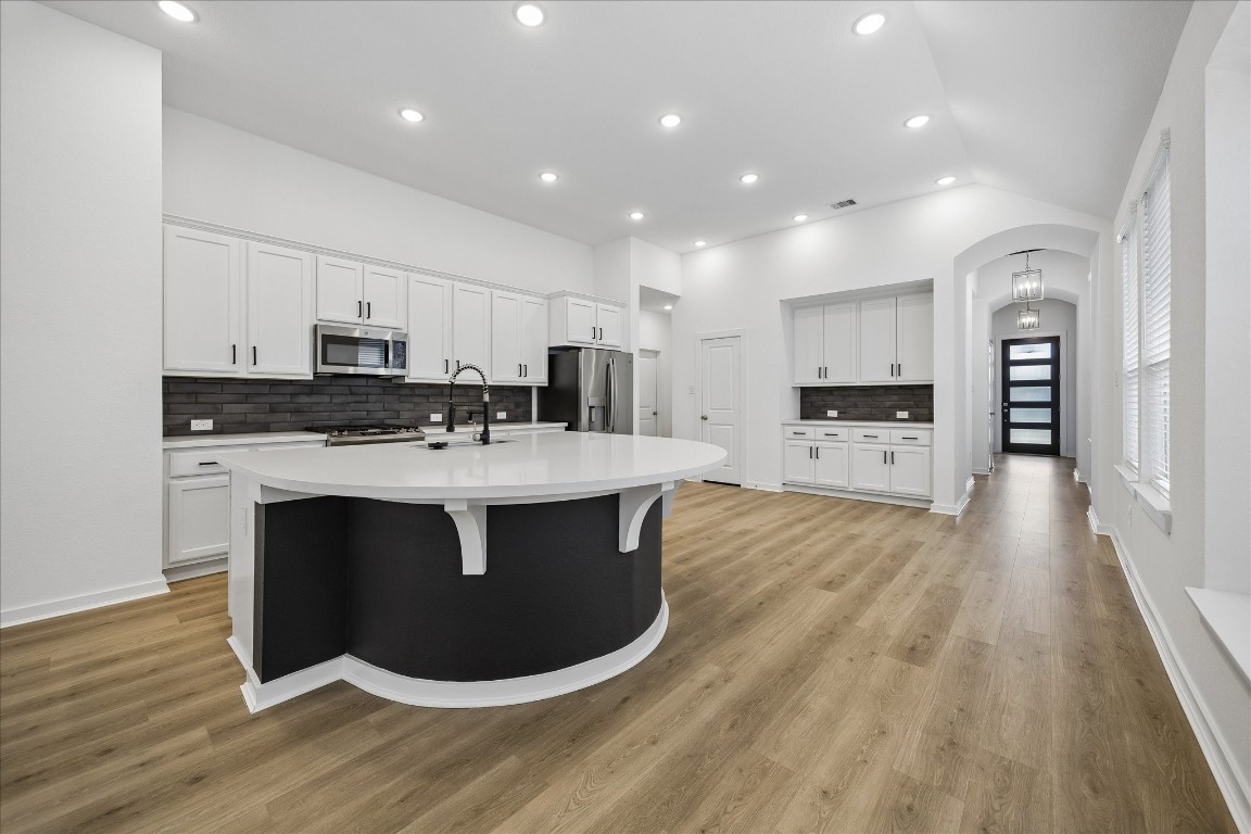 15823 Bird Of Conroe, TX 77302 - Photo 6 of 27 a view of kitchen with stainless steel appliances granite countertop a stove a sink a refrigerator and white cabinets