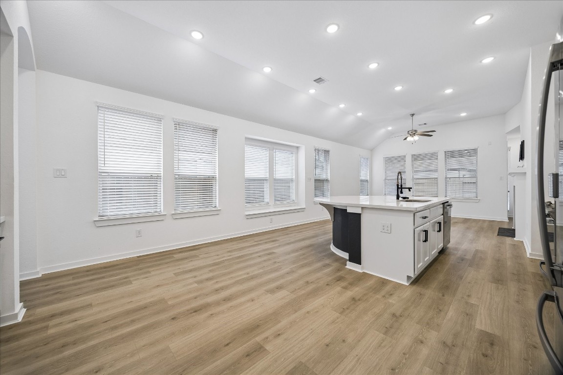 15823 Bird Of Conroe, TX 77302 - Photo 8 of 27 a large kitchen with stainless steel appliances granite countertop a large counter top and a wooden floors