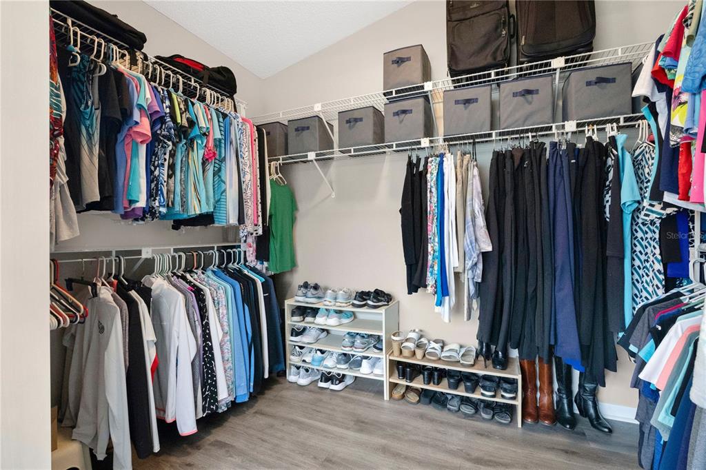 9426 Palm Tree Drive Windermere, FL 34786 - Photo 14 of 29 a view of walk in closet with clothes and shoes