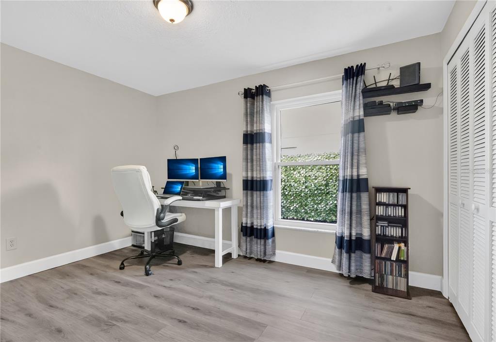 9426 Palm Tree Drive Windermere, FL 34786 - Photo 16 of 29 a view of a workspace with furniture and a window