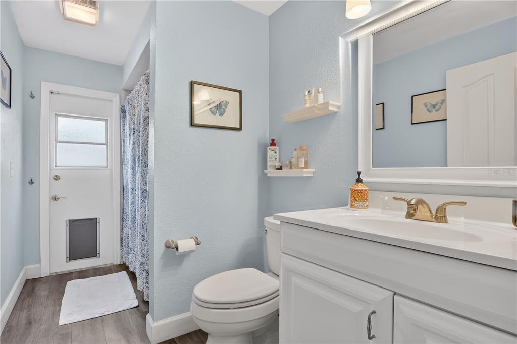 9426 Palm Tree Drive Windermere, FL 34786 - Photo 17 of 29 a bathroom with a toilet sink and mirror