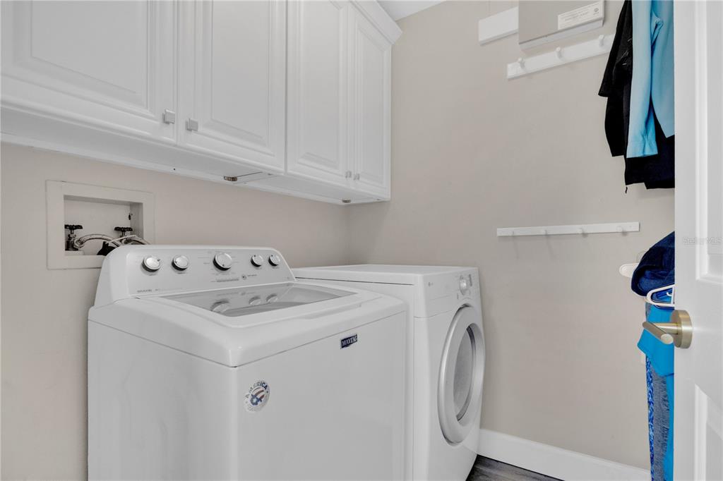 9426 Palm Tree Drive Windermere, FL 34786 - Photo 19 of 29 a utility room with dryer and washer