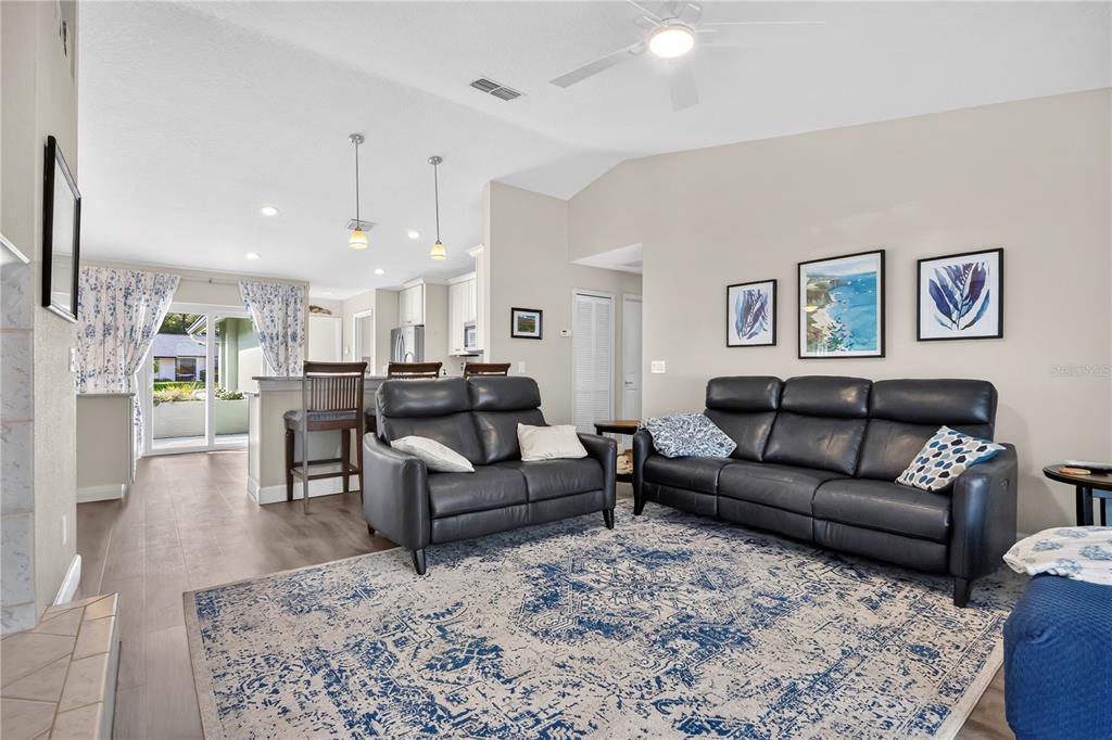 9426 Palm Tree Drive Windermere, FL 34786 - Photo 5 of 29 a living room with furniture and a view of kitchen