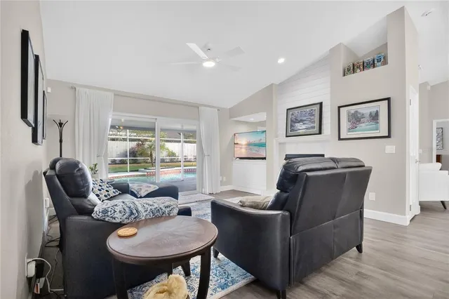 a living room with furniture and a large window