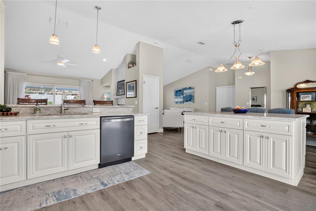 9426 Palm Tree Drive Windermere, FL 34786 - Photo 9 of 29 a kitchen with white cabinets and sink