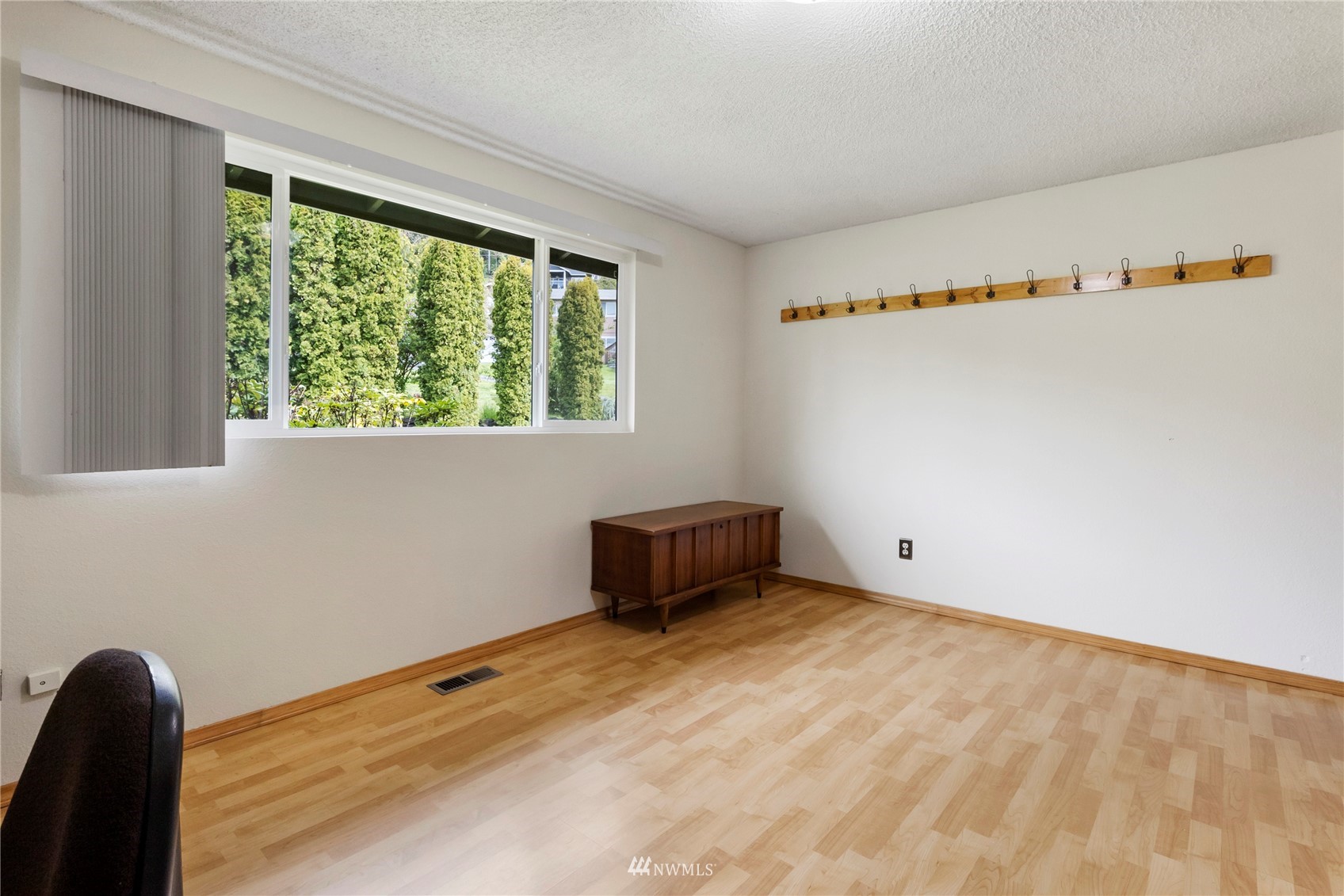 11306 Karshner Road East Edgewood, WA 98372 - Photo 15 of 31 a room with a window and a wooden floor
