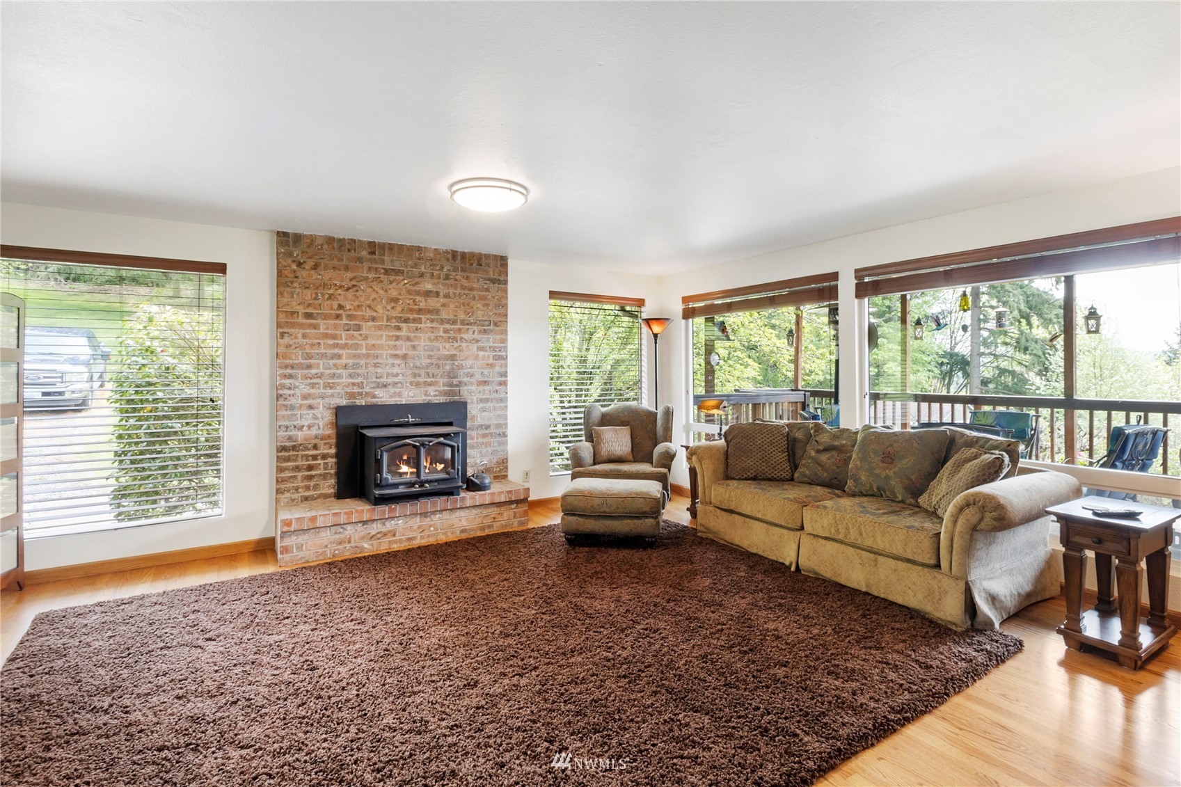 11306 Karshner Road East Edgewood, WA 98372 - Photo 5 of 31 a living room with furniture and a fireplace