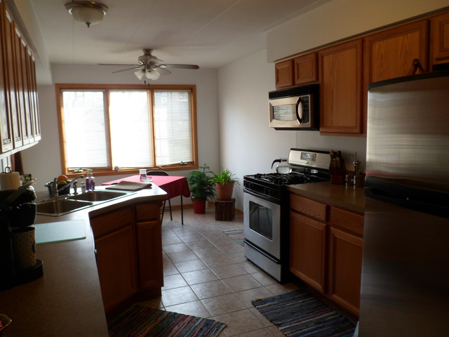 10538 SW Highway, Unit 203B Chicago Ridge, IL 60415 - Photo 5 of 14 a kitchen with a refrigerator stove and sink