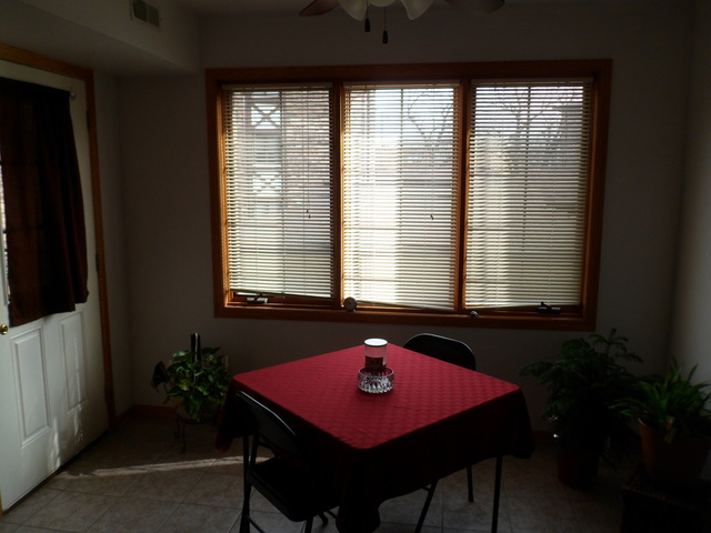 10538 SW Highway, Unit 203B Chicago Ridge, IL 60415 - Photo 6 of 14 a dining room with a table and chairs