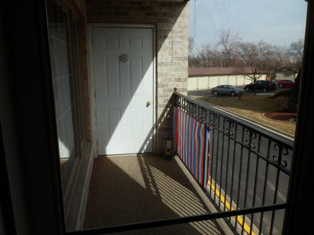 10538 SW Highway, Unit 203B Chicago Ridge, IL 60415 - Photo 8 of 14 a view of balcony and wooden floor