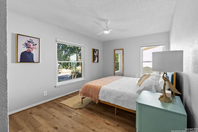 a bedroom with a bed and window