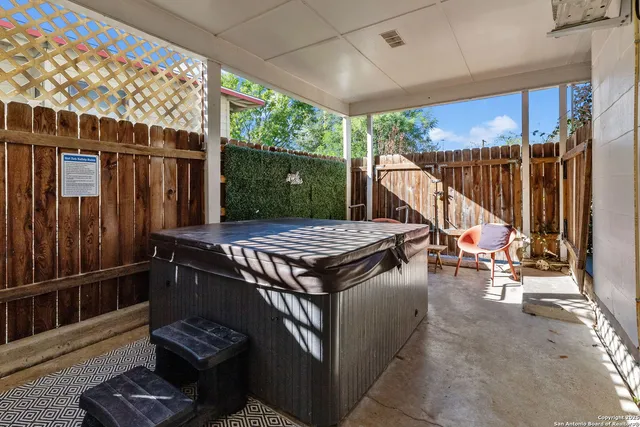 a view of a chairs and table in the patio
