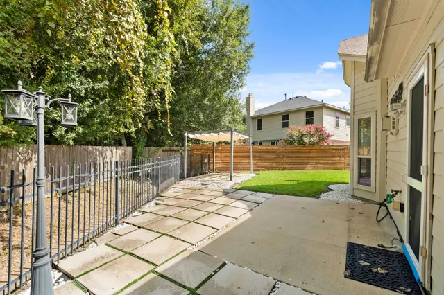a view of a patio with a yard