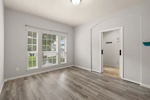 a view of a kitchen with refrigerator and a fireplace