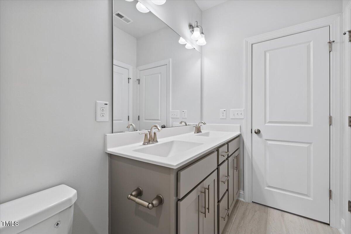 4716 Crescent Square Street, Unit 1314 Raleigh, NC 27616 - Photo 39 of 61 Bathroom with dual vanities on second level