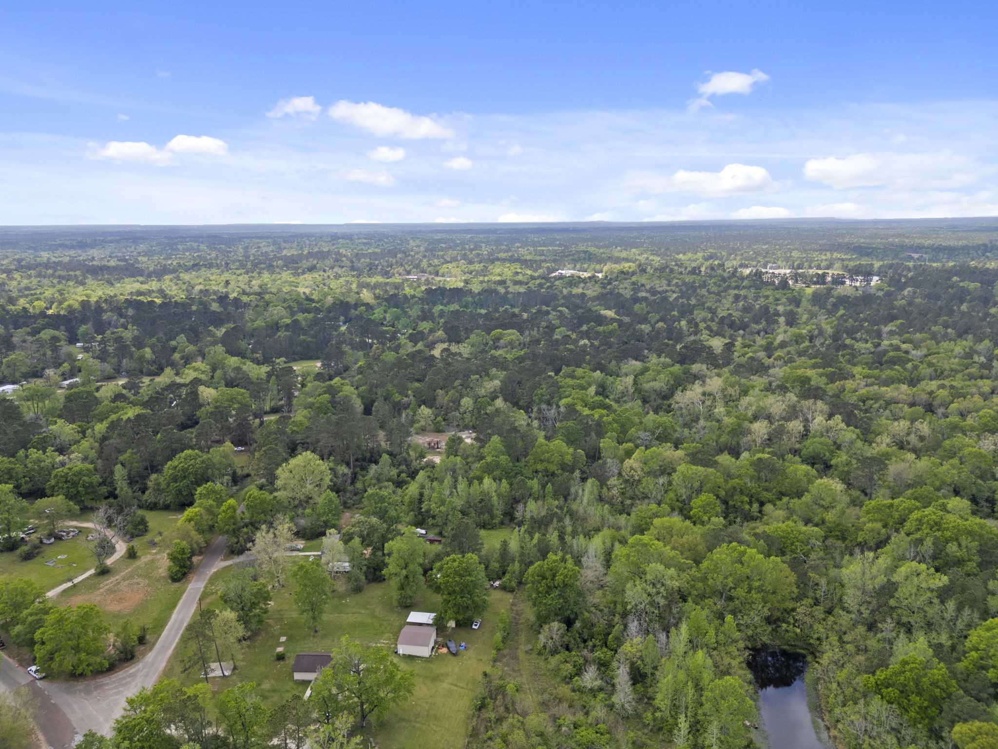 0 Old Texaco Camp Road Conroe, TX 77302 - Photo 4 of 8 an aerial view of residential houses with outdoor space and trees