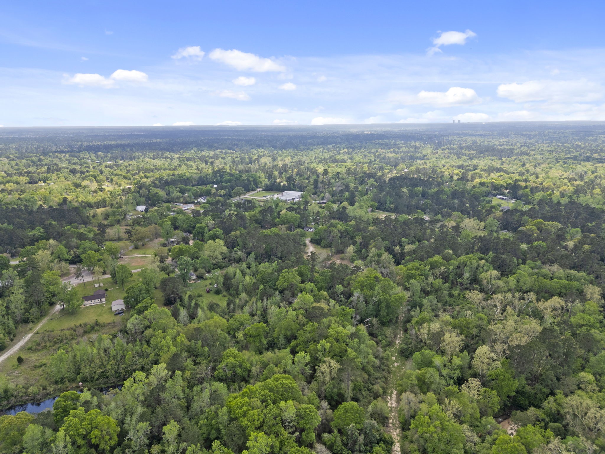 0 Old Texaco Camp Road Conroe, TX 77302 - Photo 5 of 8 an aerial view of a city with lots of residential buildings