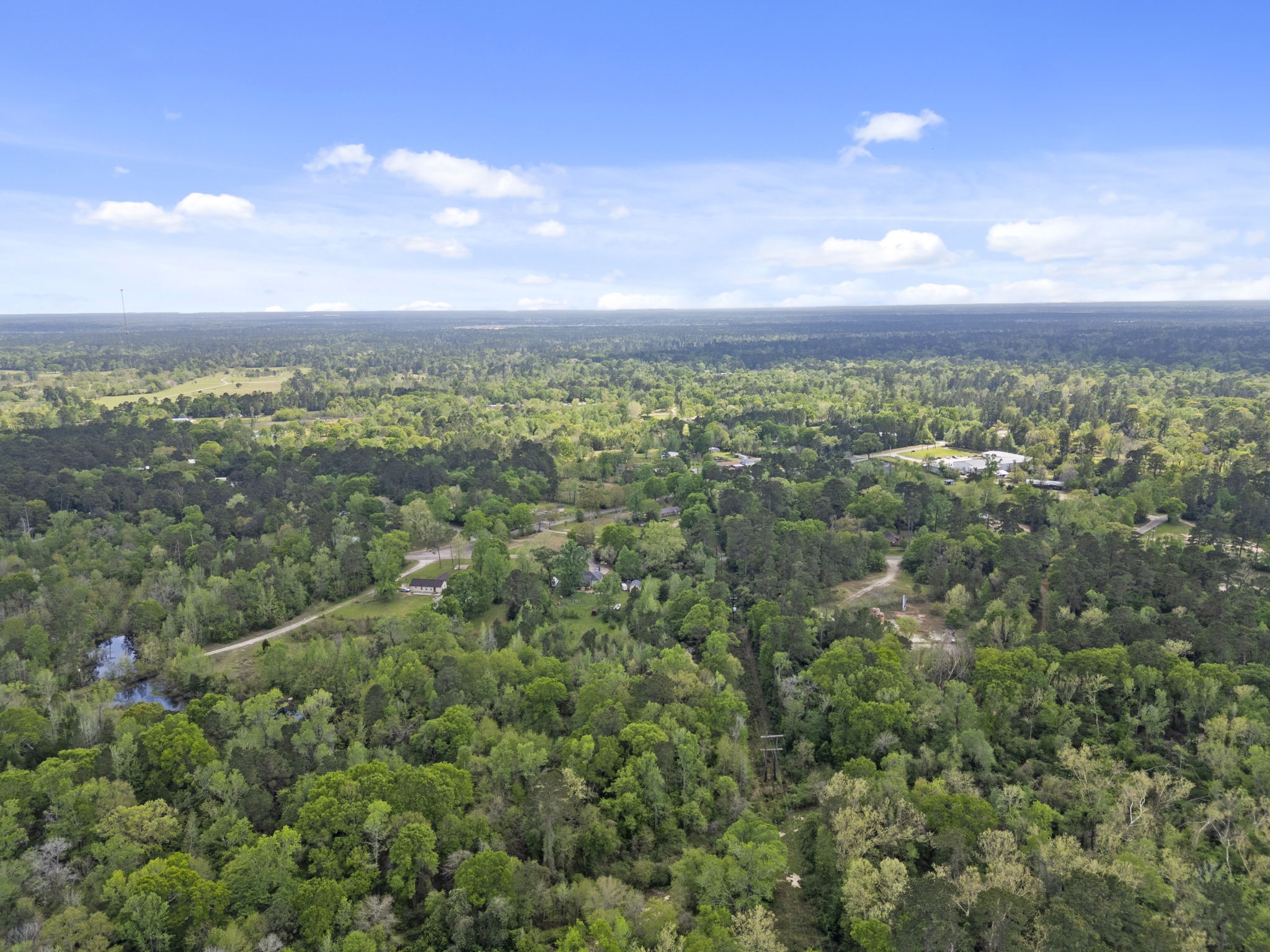 0 Old Texaco Camp Road Conroe, TX 77302 - Photo 6 of 8 a view of a city with lush green forest