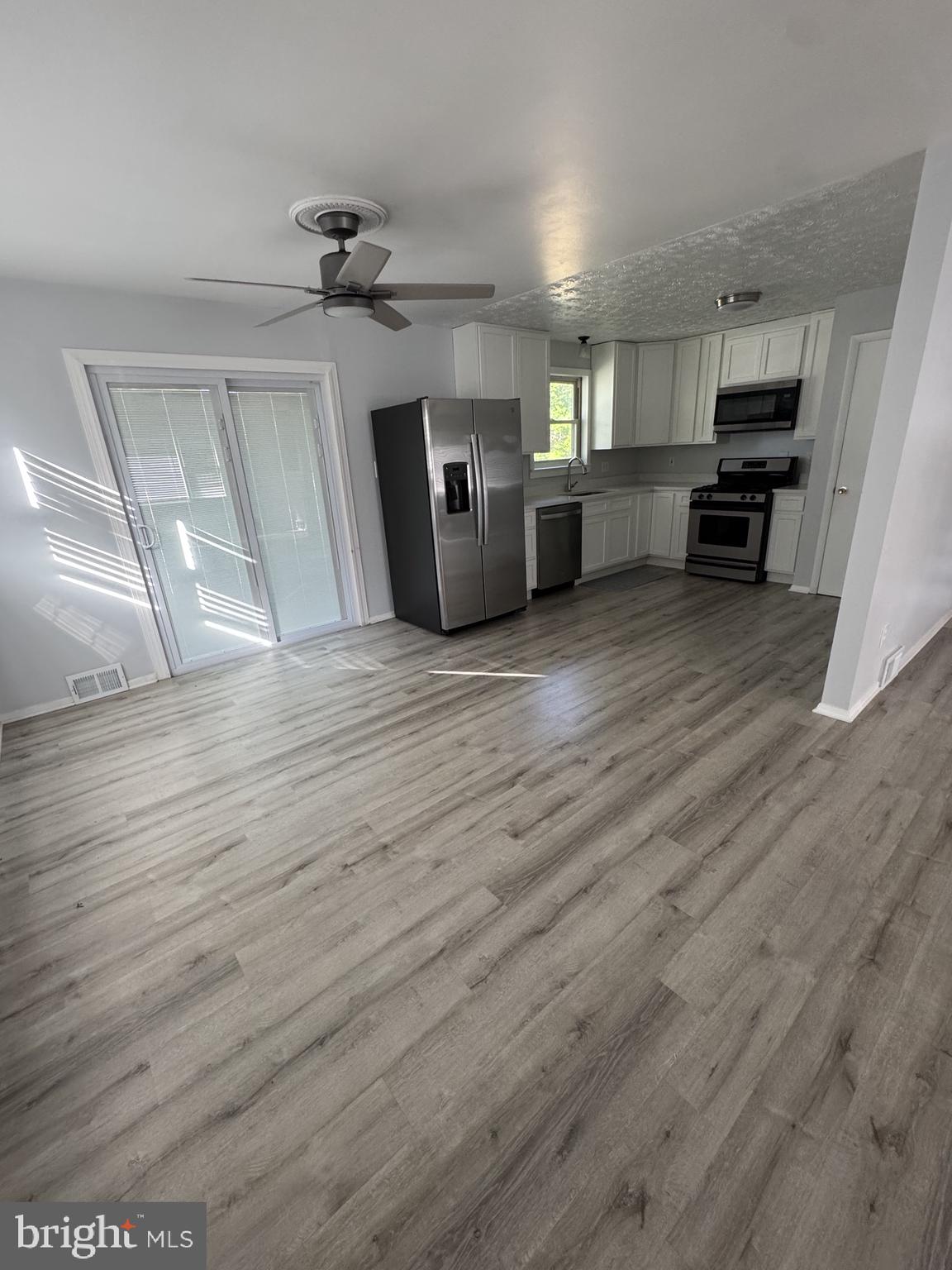 7410 Dickenson Street Springfield, VA 22150 - Photo 5 of 14 Modern kitchen with sleek finishes.
