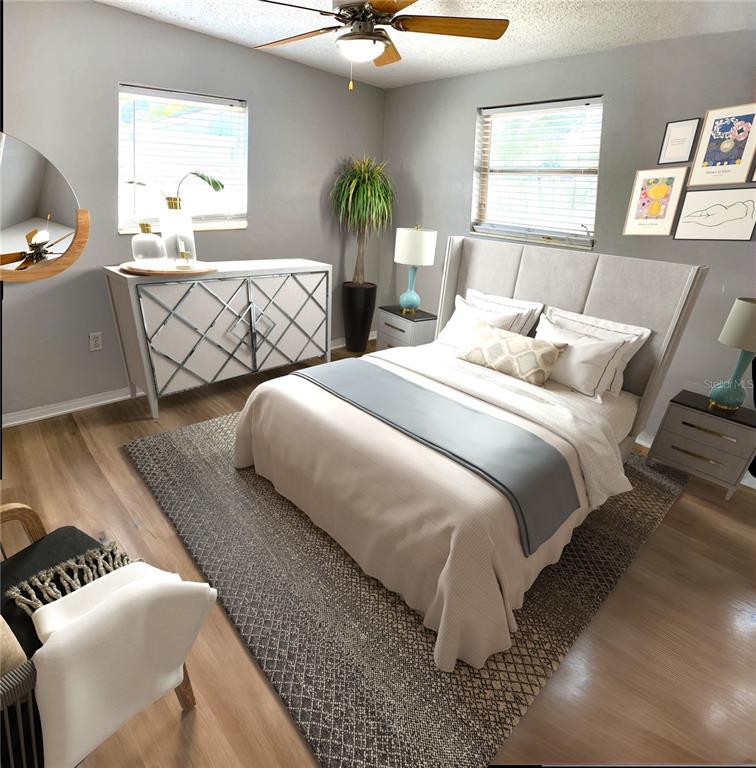 9596 Groveland Street Seminole, FL 33772 - Photo 11 of 26 a bedroom with double bed and a window