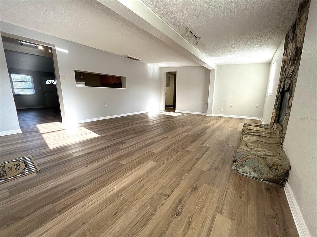 9596 Groveland Street Seminole, FL 33772 - Photo 15 of 26 a view of a living room with wooden floor