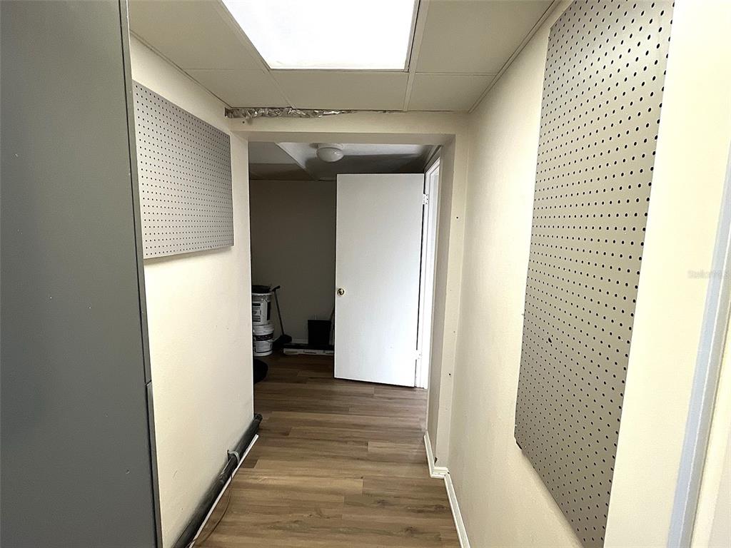 9596 Groveland Street Seminole, FL 33772 - Photo 22 of 26 a view of a hallway with wooden floor and staircase