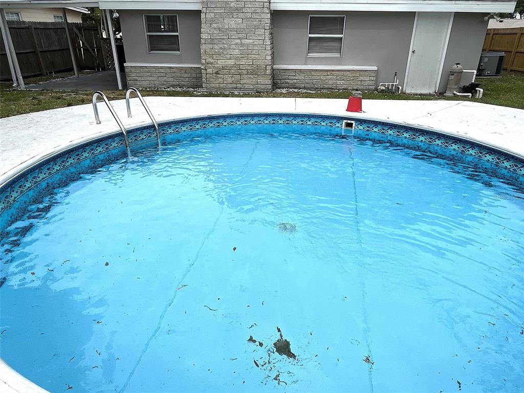 9596 Groveland Street Seminole, FL 33772 - Photo 4 of 26 a view of swimming pool with yard