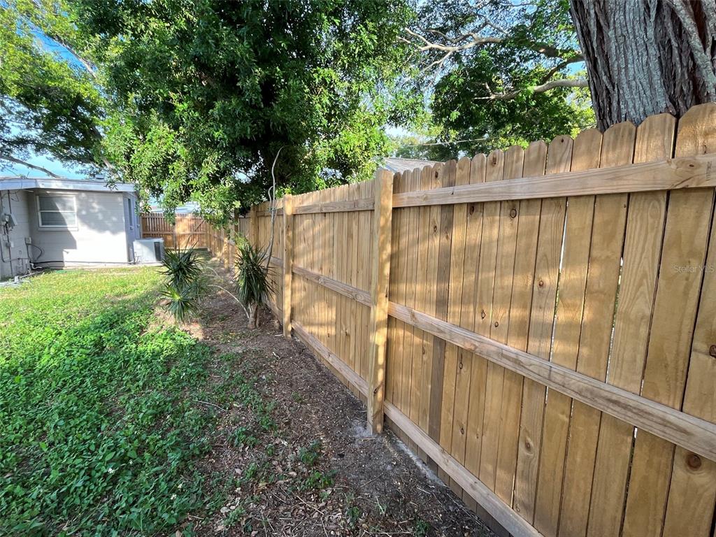 9596 Groveland Street Seminole, FL 33772 - Photo 5 of 26 a view of a backyard with a trees