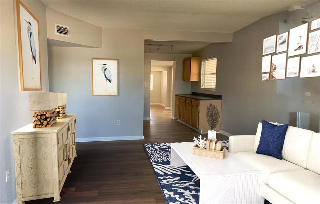 9596 Groveland Street Seminole, FL 33772 - Photo 7 of 26 a bedroom with a bed and wooden floor