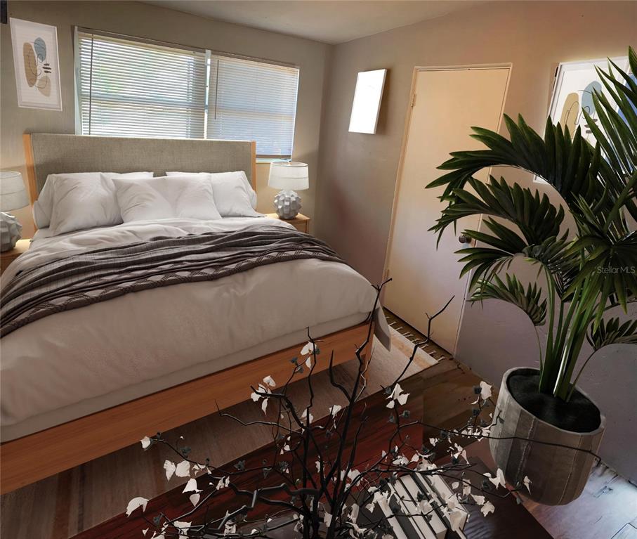 9596 Groveland Street Seminole, FL 33772 - Photo 9 of 26 a bedroom with a bed and a potted plant