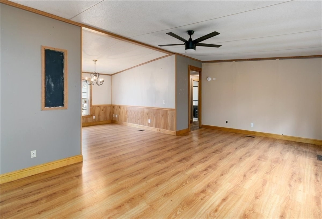 84 Forest Road Salisbury, MA 01952 - Photo 12 of 28 a view of empty room with wooden floor and fan