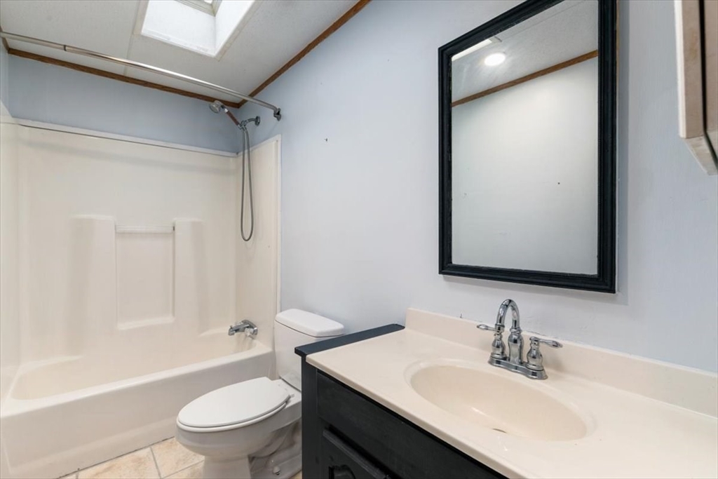 84 Forest Road Salisbury, MA 01952 - Photo 14 of 28 a bathroom with a sink toilet tub and shower