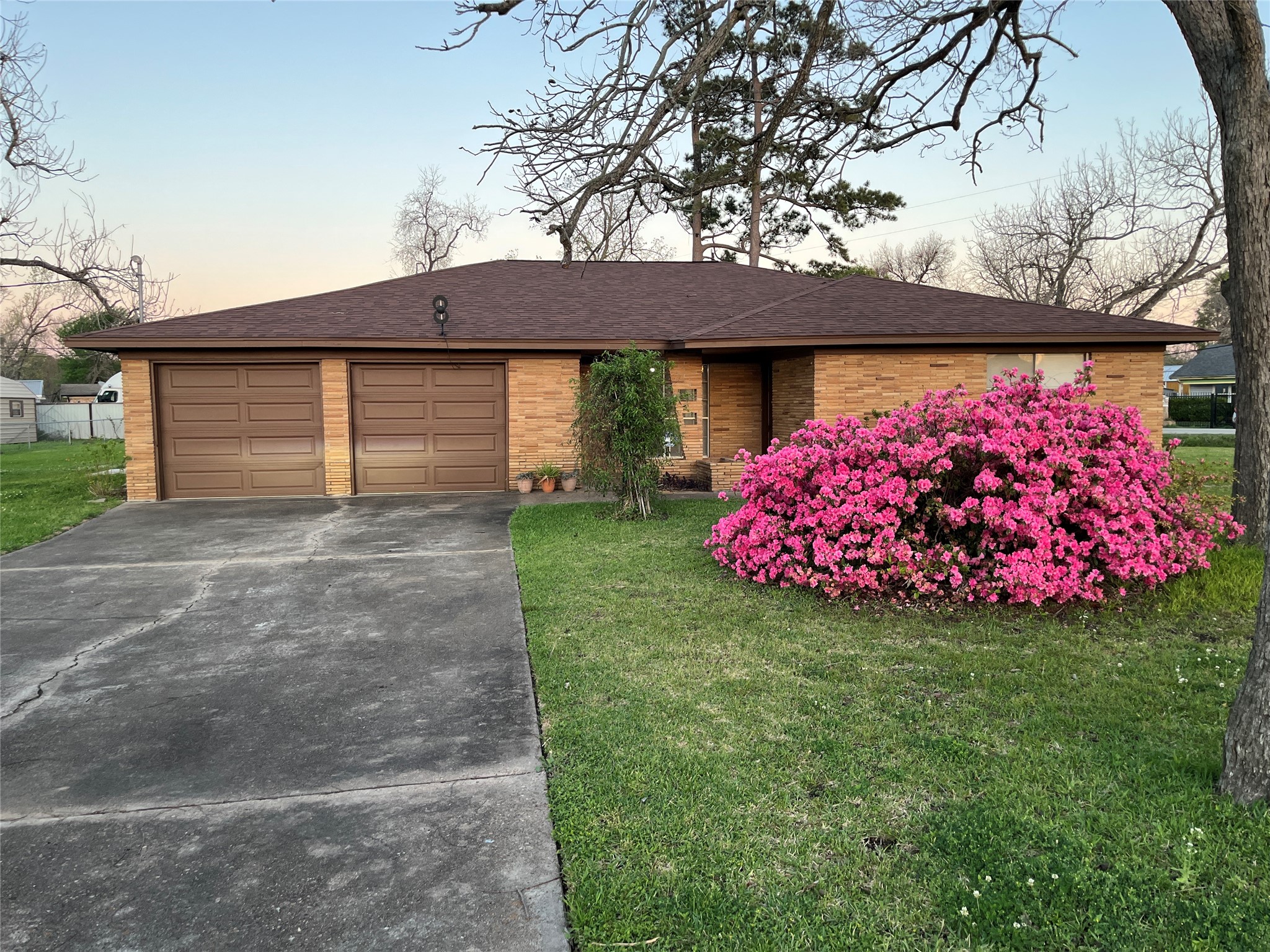 1202 Pecan Street Channelview, TX 77530 - Photo 1 of 35 a front view of a house with garden