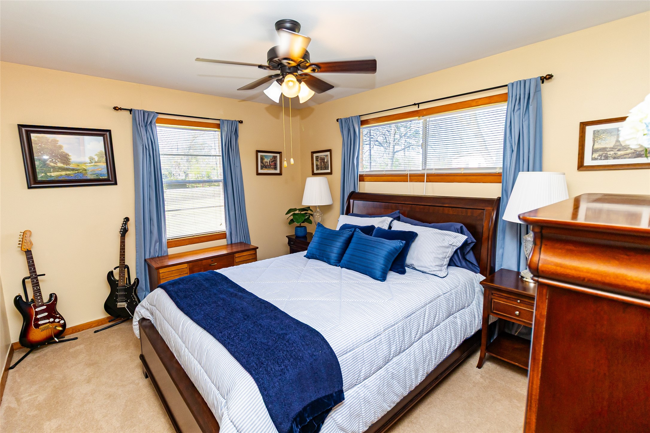 1202 Pecan Street Channelview, TX 77530 - Photo 13 of 35 a bedroom with a bed and a chandelier