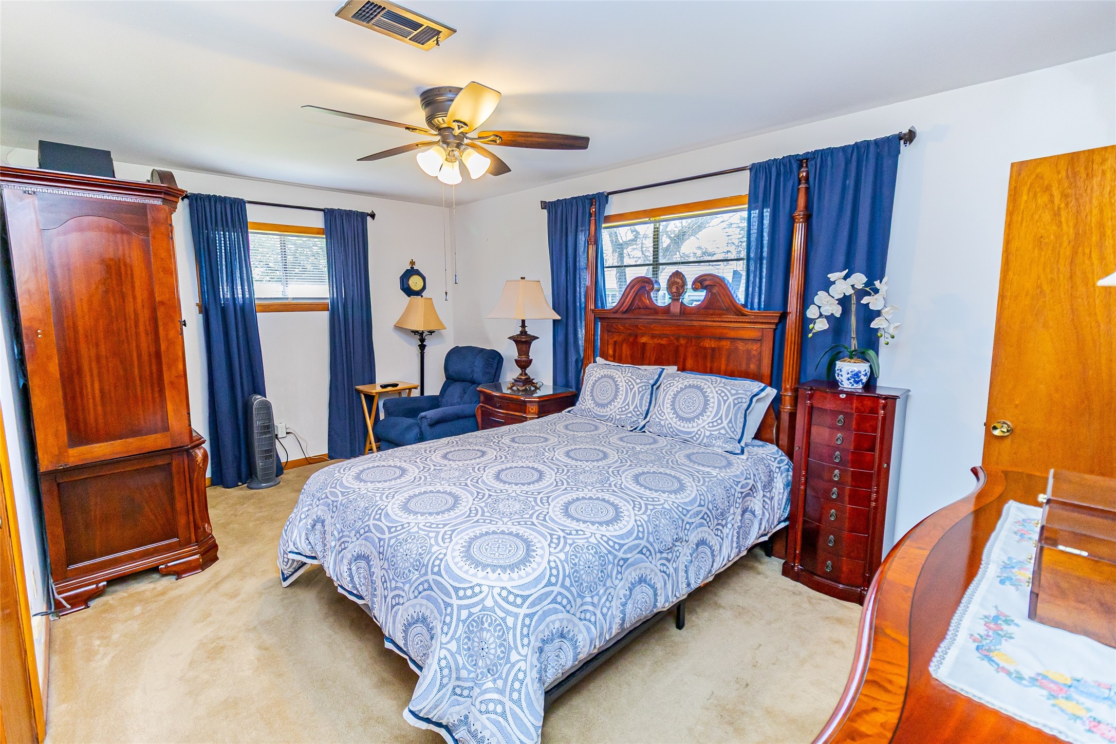 1202 Pecan Street Channelview, TX 77530 - Photo 18 of 35 a bedroom with a bed and wooden floor