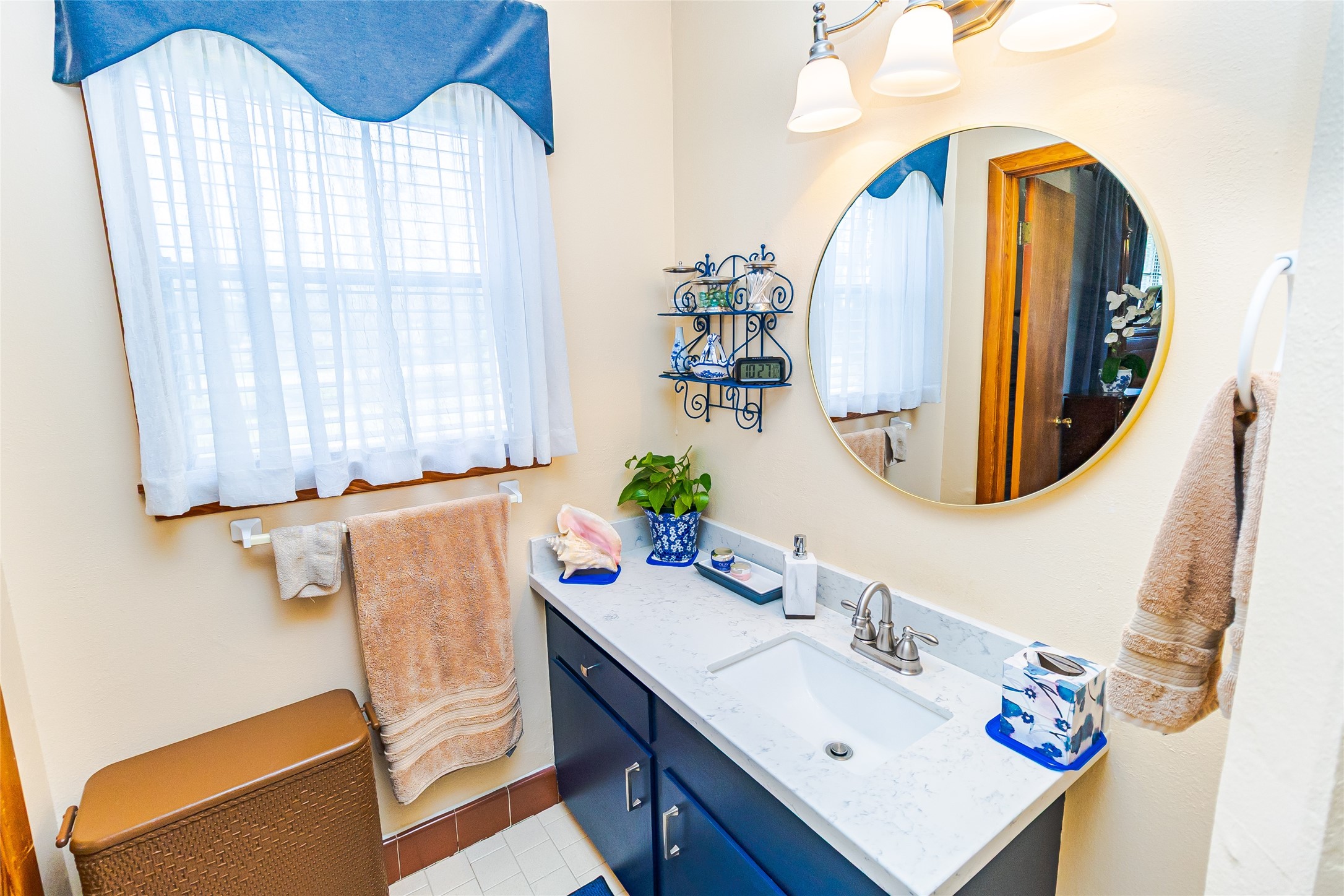 1202 Pecan Street Channelview, TX 77530 - Photo 20 of 35 a bathroom with a sink vanity and a mirror