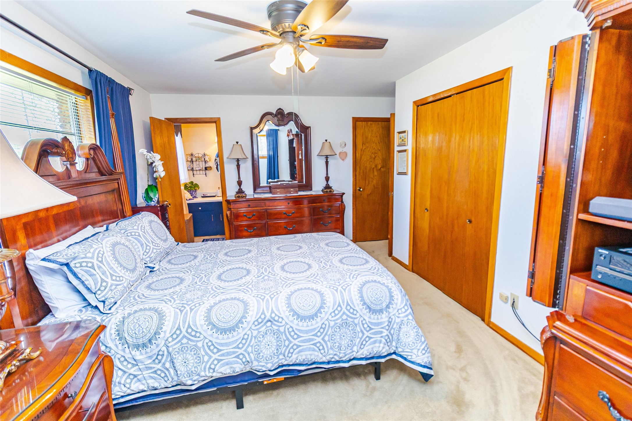 1202 Pecan Street Channelview, TX 77530 - Photo 21 of 35 a bedroom with a bed and a chandelier