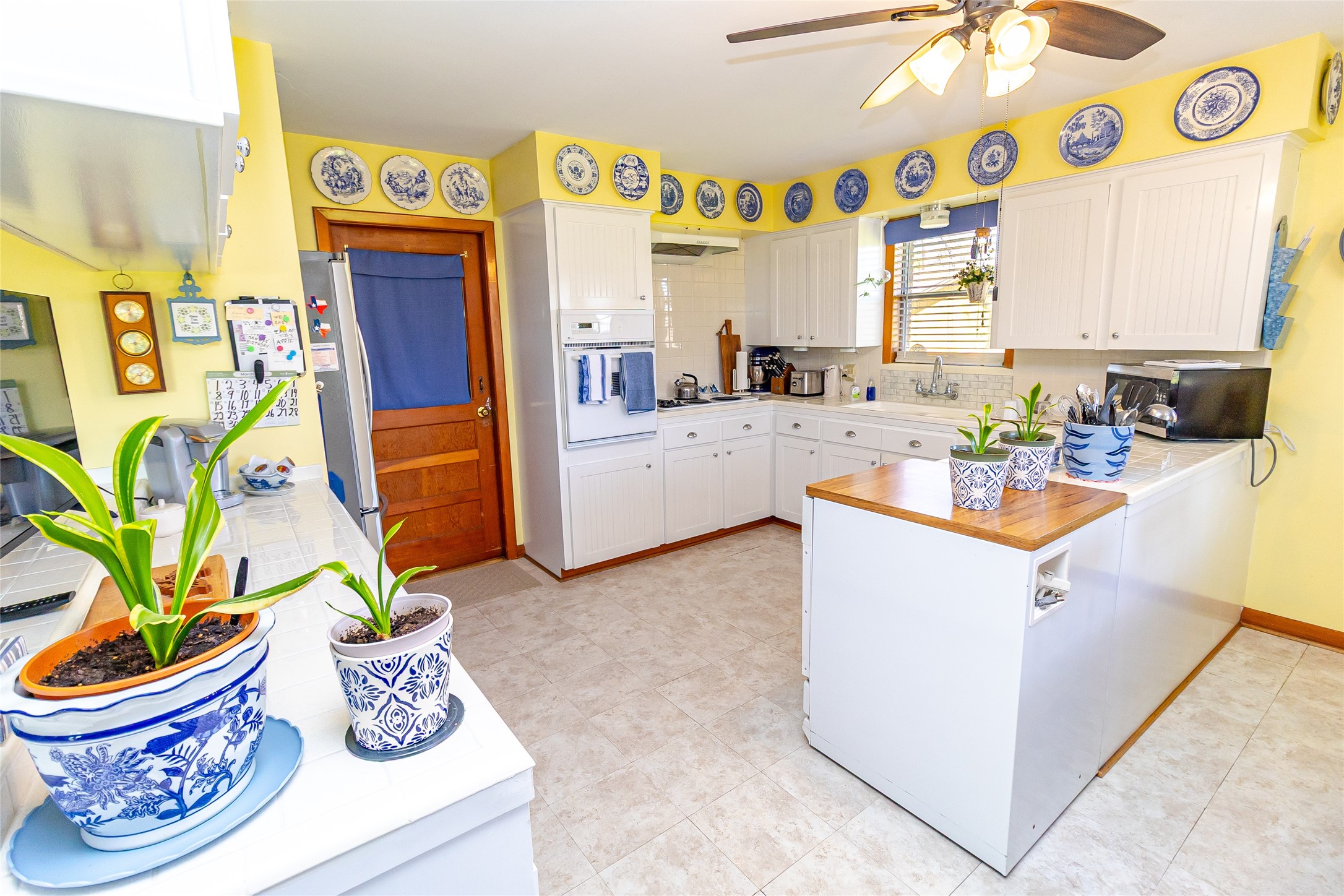 1202 Pecan Street Channelview, TX 77530 - Photo 26 of 35 a kitchen with a refrigerator and a stove