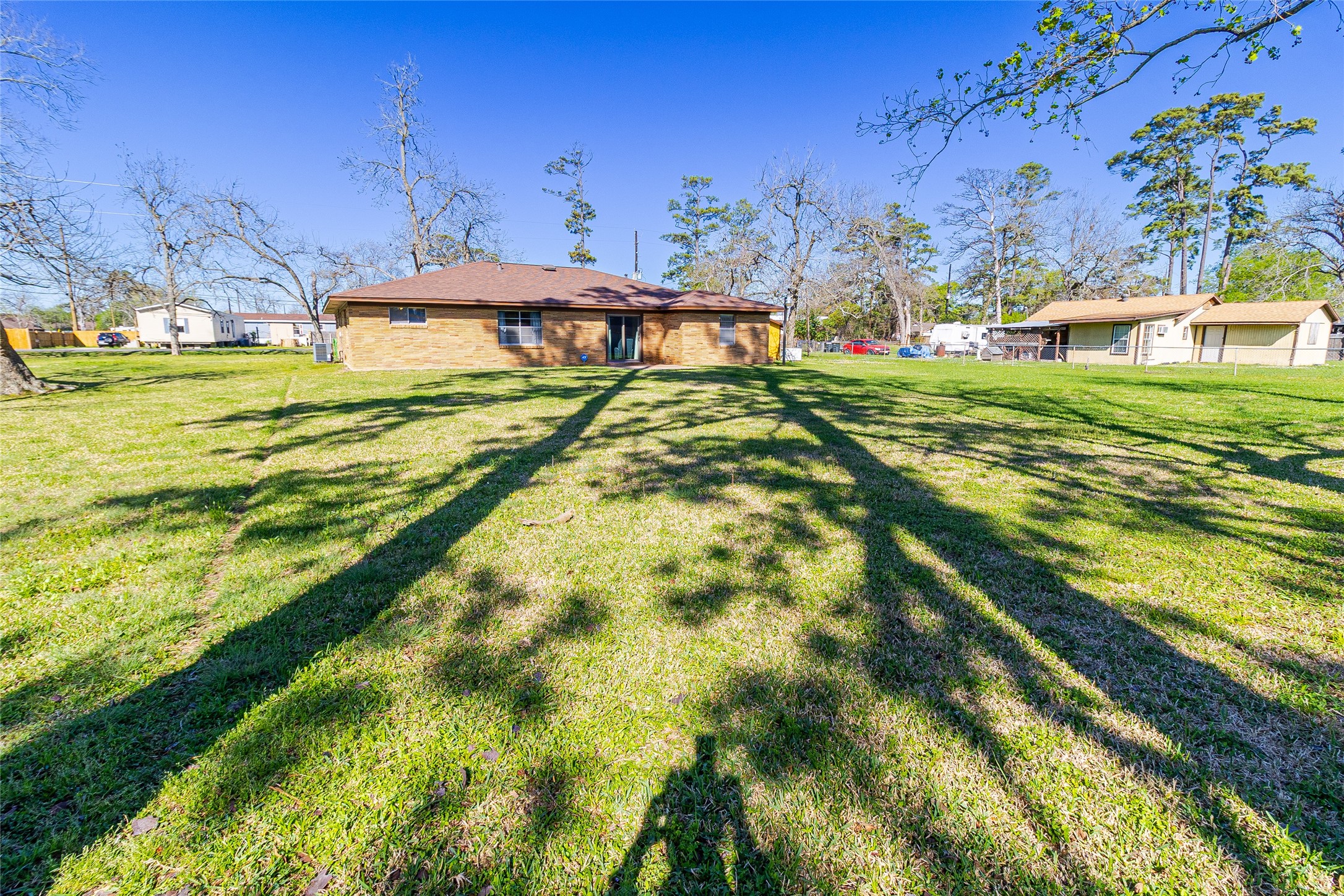 1202 Pecan Street Channelview, TX 77530 - Photo 29 of 35 a view of a swimming pool with a yard
