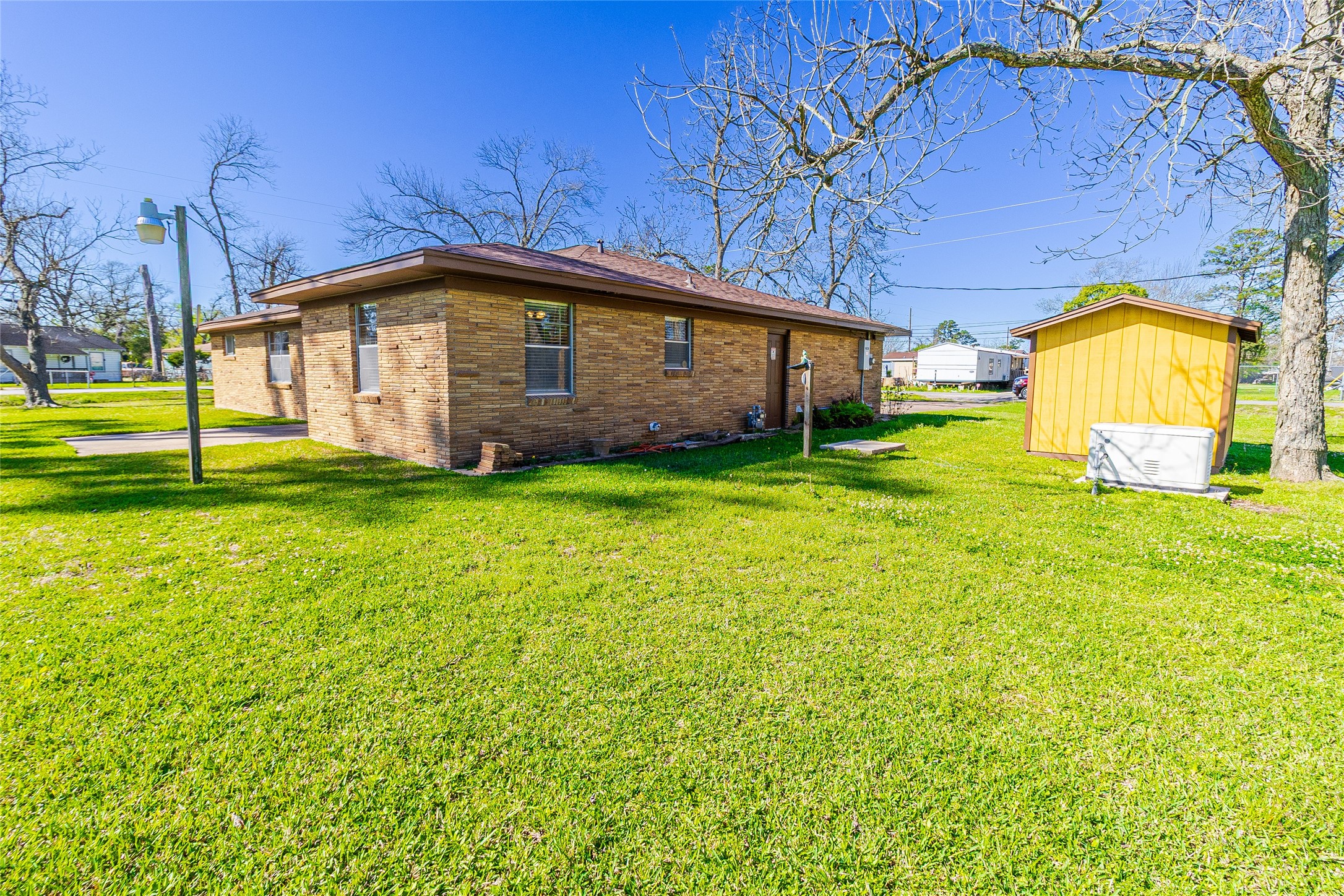 1202 Pecan Street Channelview, TX 77530 - Photo 33 of 35 a big house with a big yard and large trees