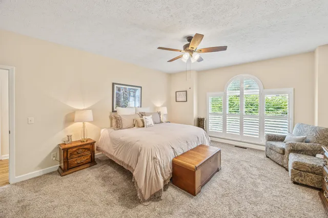 a bathroom with a tub shower and a sink