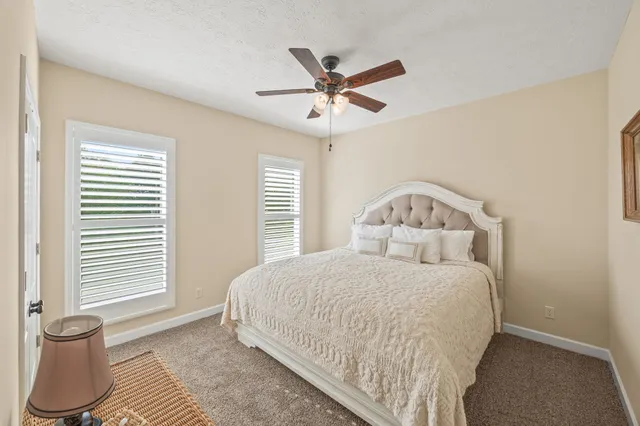 a room with pool table and window