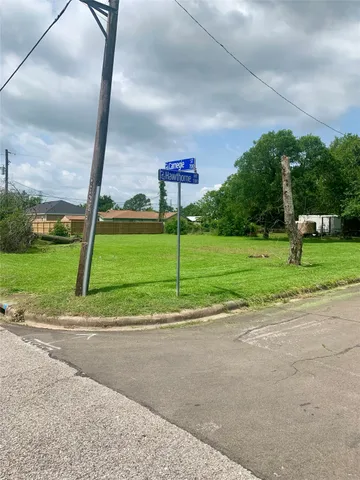 a view of a golf course with a street