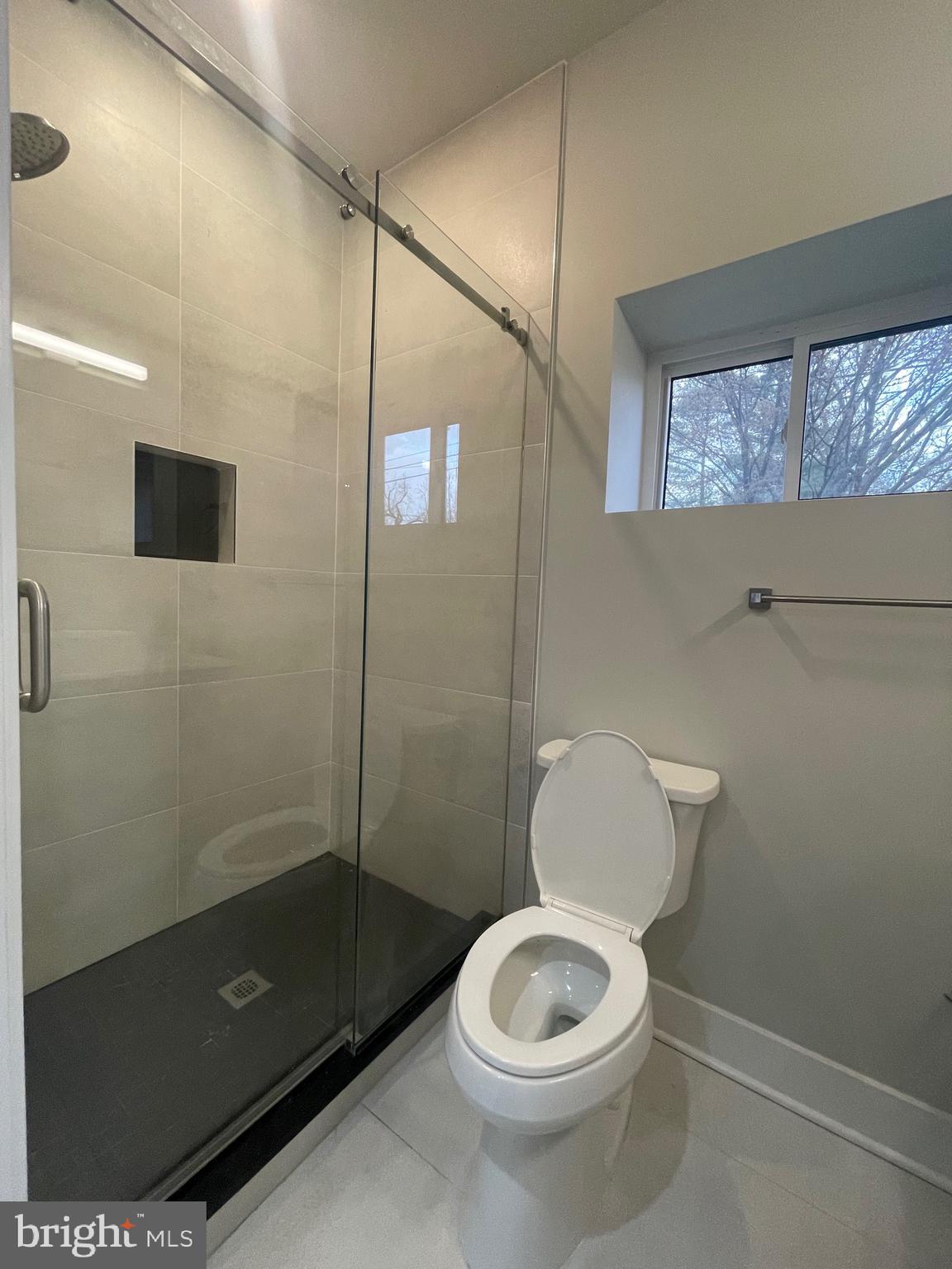 8618 Jones Mill Road Chevy Chase, MD 20815 - Photo 17 of 52 a bathroom with a toilet a sink and shower