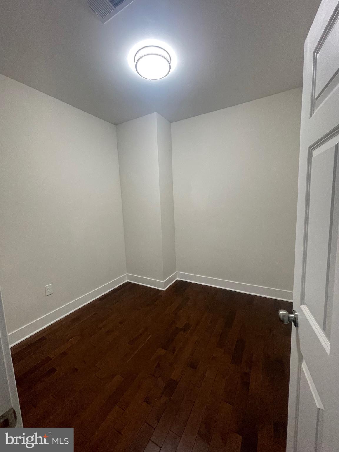 8618 Jones Mill Road Chevy Chase, MD 20815 - Photo 21 of 52 a view of an empty room with a window